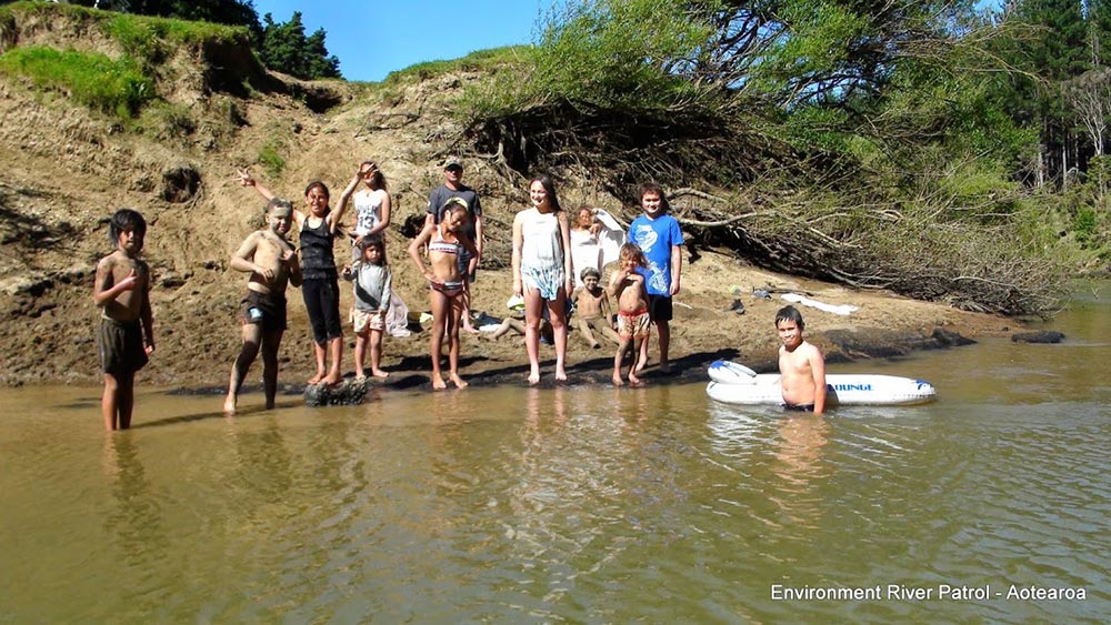 New Zealand Children Play in Feces River