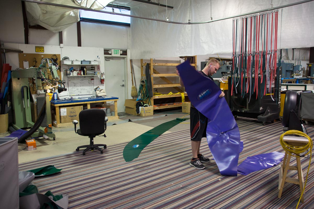 AIRE Raft Employee Prepares Fabric Material