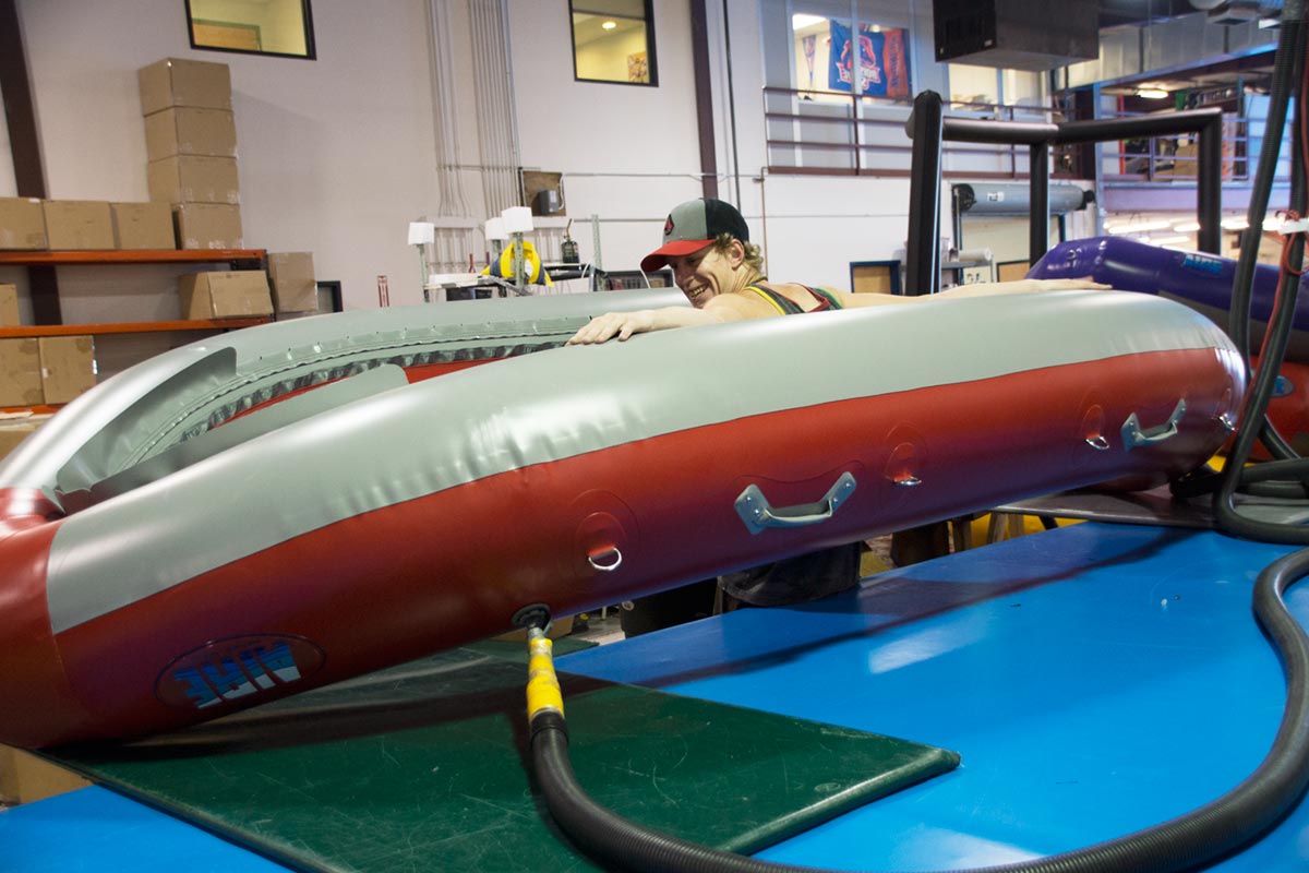 AIRE Red Super Puma Raft Inflated Hull Being Inspected