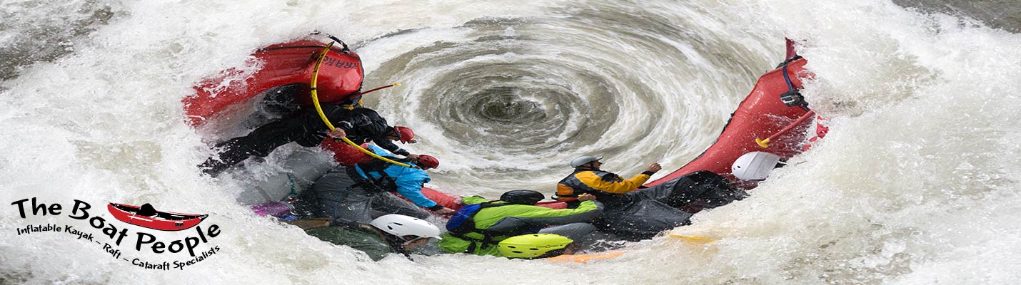 Red raft going down the whirlpool